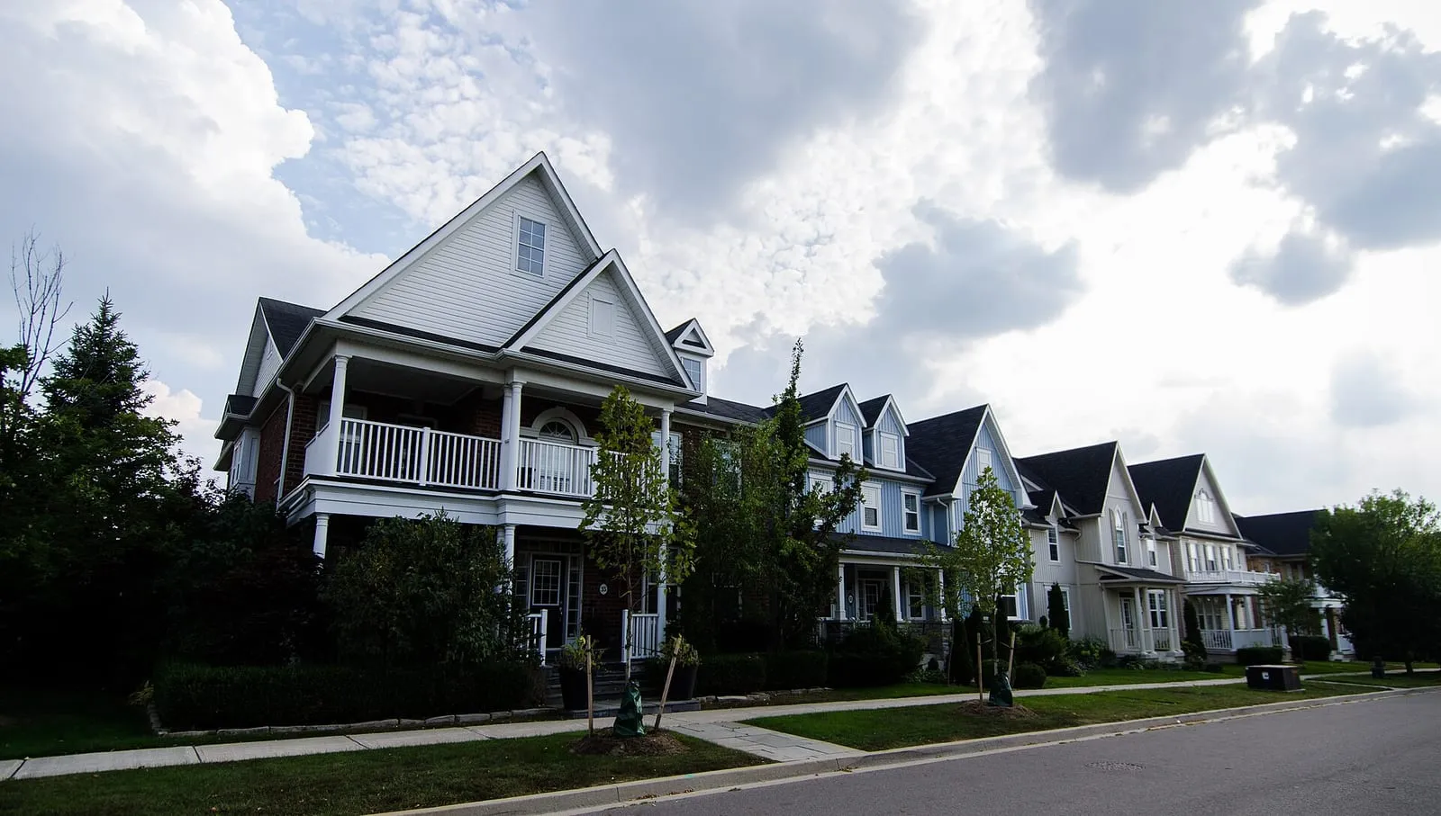 A row of large porch-front homes on Harper Hill Road in Angus Glen, Markham.