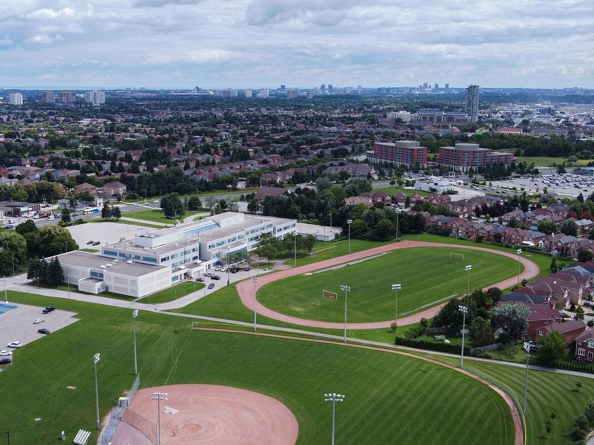 Aerial view of Milliken Mills High School playing fields and the surrounding homes in Milliken Mills, Markham.